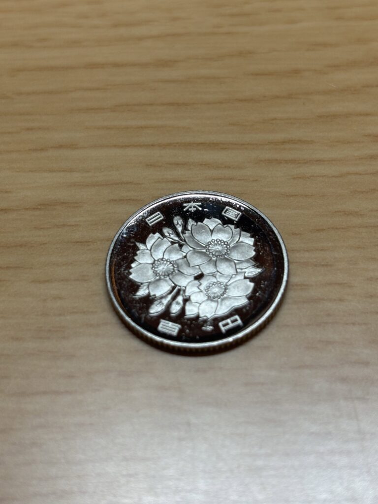 自販機から出てきた100円玉②（＠art_9xvさんより提供）